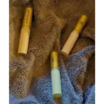 Elixian Essence Lipsonessence lip balm tubes in various colors, showcasing different shades and flavors