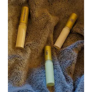 Elixian Essence Lipsonessence lip balm tubes in various colors, showcasing different shades and flavors